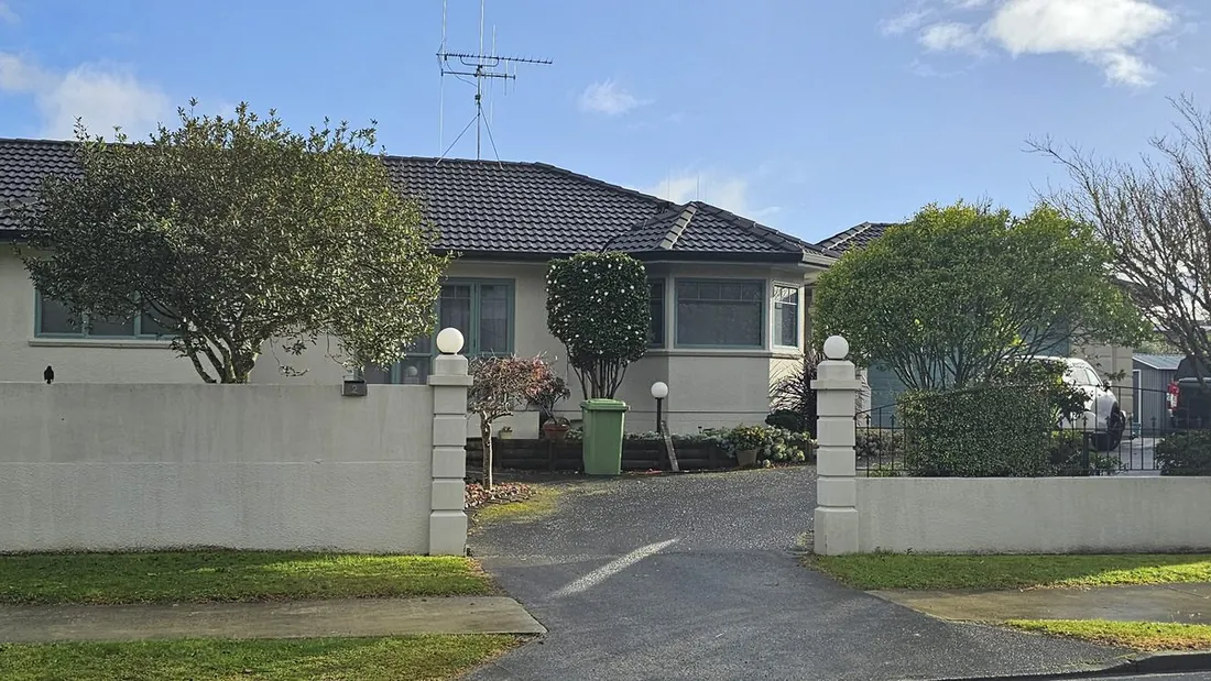 Green wheelie bin out for collection at a Takanini home